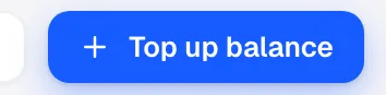 The Top up balance button in the top right of the Billing page